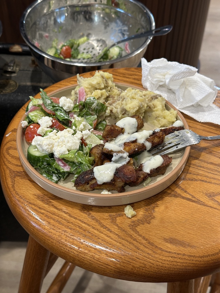 Marinated chicken with salad and mashed potatoes
