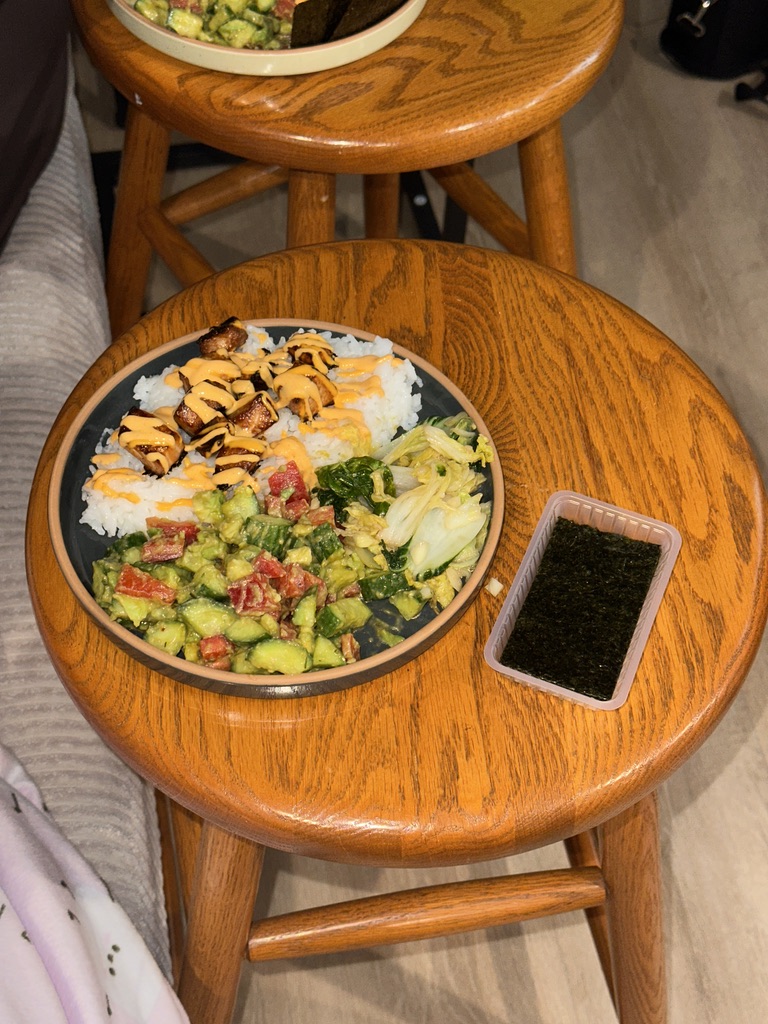 Plated sticky rice with salmon and salad
